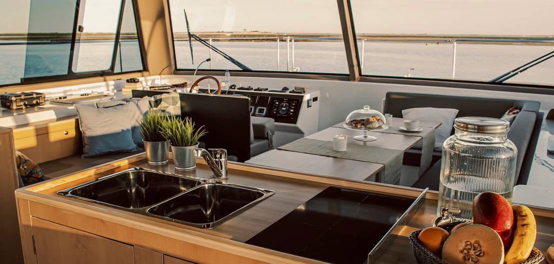 On board at golden hour, the helm and galley